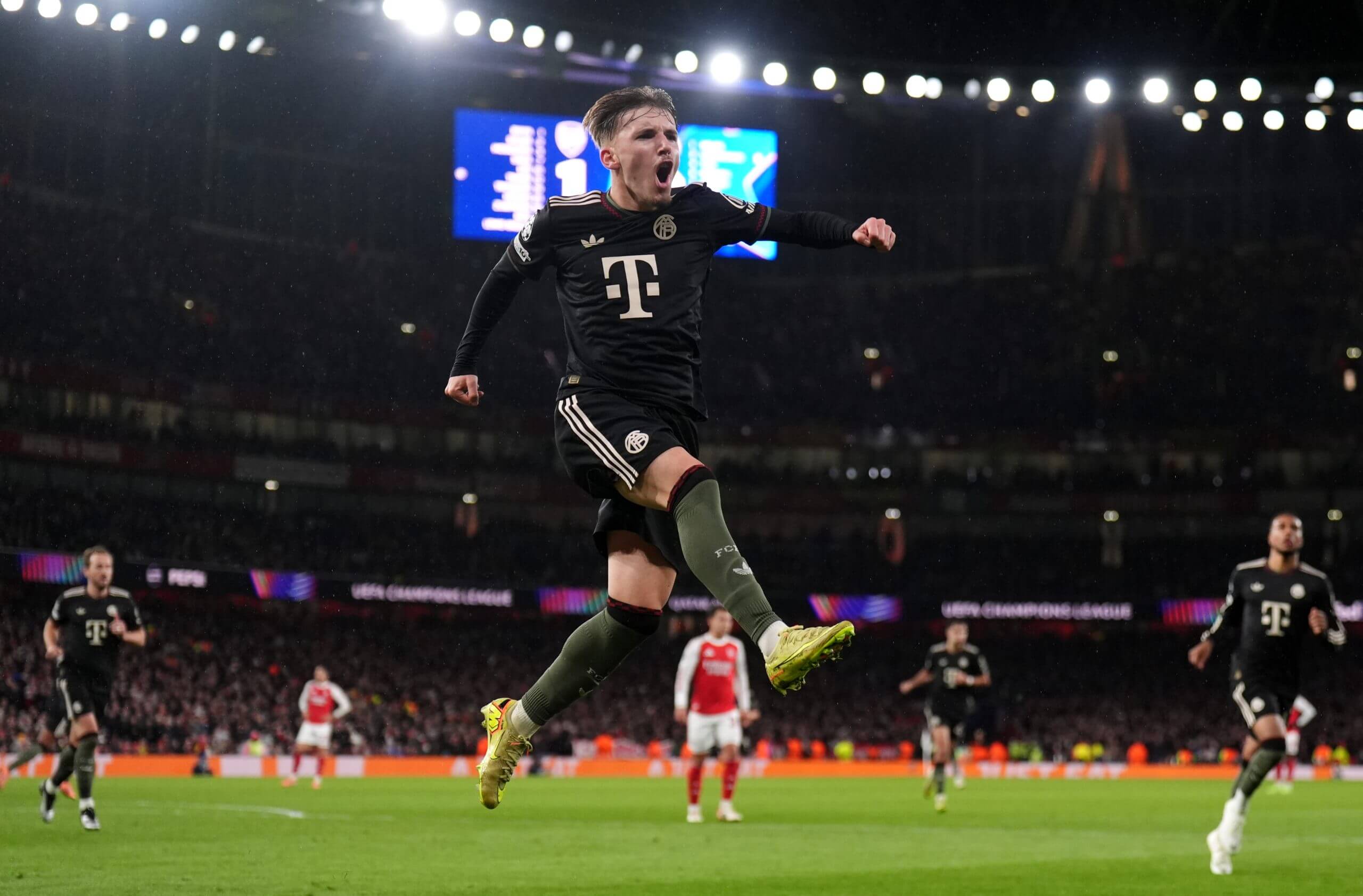 Lennart Karl leaps after scoring for Bayern Munich against Arsenal