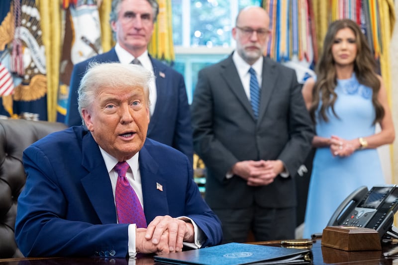 US President Donald Trump speaks about the upcoming wildfire and hurricane seasons, alongside Secretary of the Interior Doug Burgum (L), OMB Director Russell Vought (C) and Secretary of Homeland Security Kristi Noem (R) in the Oval Office of the White House in Washington, DC, on June 10, 2025. (Photo by SAUL LOEB / AFP) (Photo by SAUL LOEB/AFP via Getty Images)