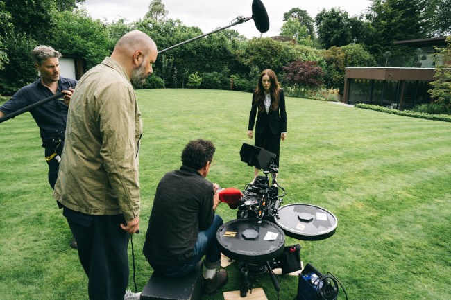 BUGONIA, from left: director Yorgos Lanthimos, cinematographer Robbie Ryan, Emma Stone, on set, 2025. ph: Atsushi Nishijima / ©Focus Features / Courtesy Everett Collection