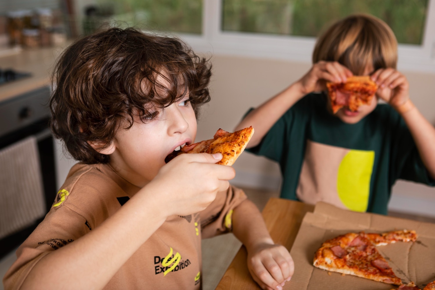 Children are more prone to eating unhealthy, high calorie foods like pizza. (Picture credit: Freepik)
