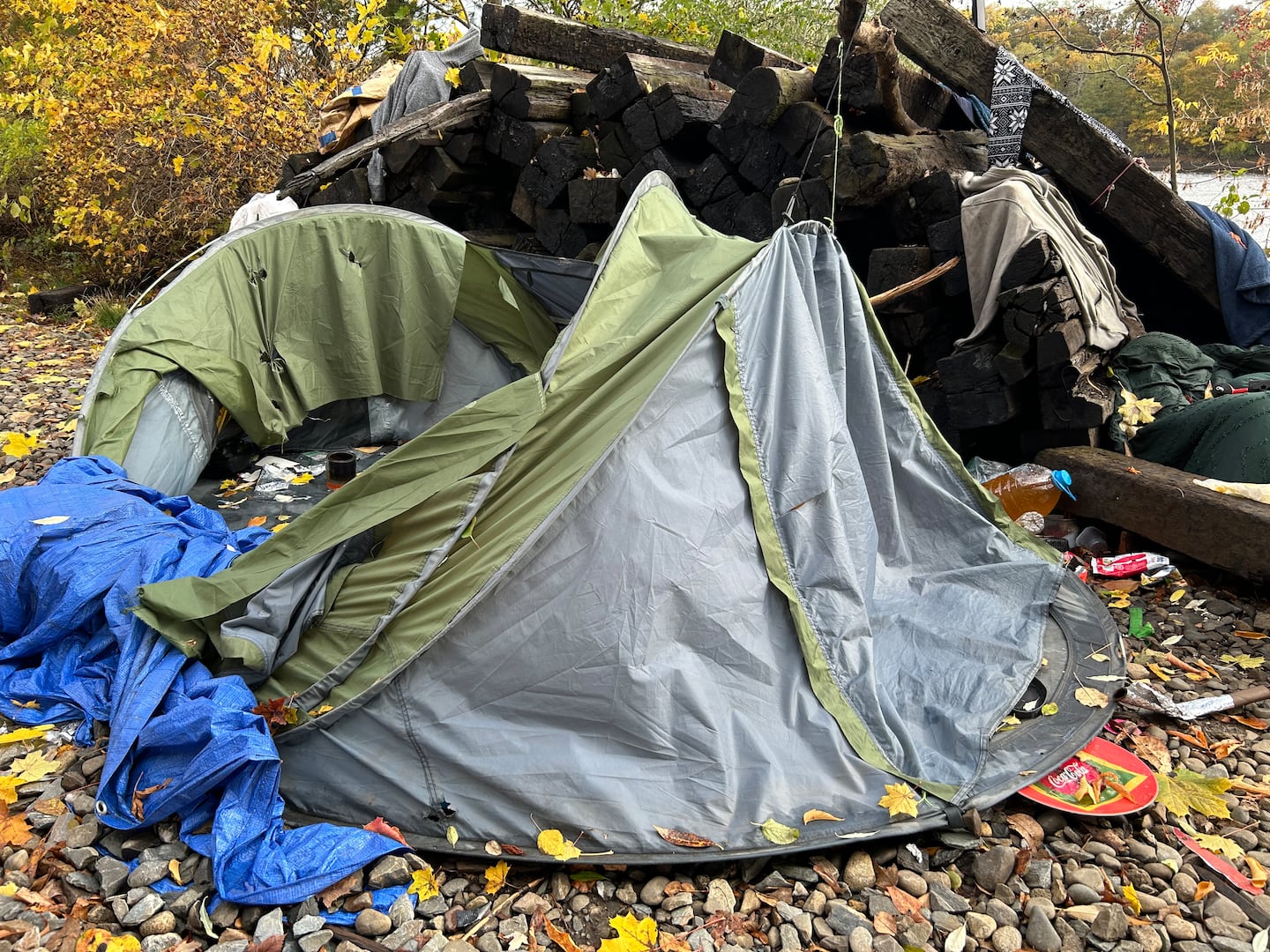 Steven Cronk’s tent was shredded and ransacked recently. Such incidents aren’t uncommon at a homeless encampment along the Penobscot River in Bangor.