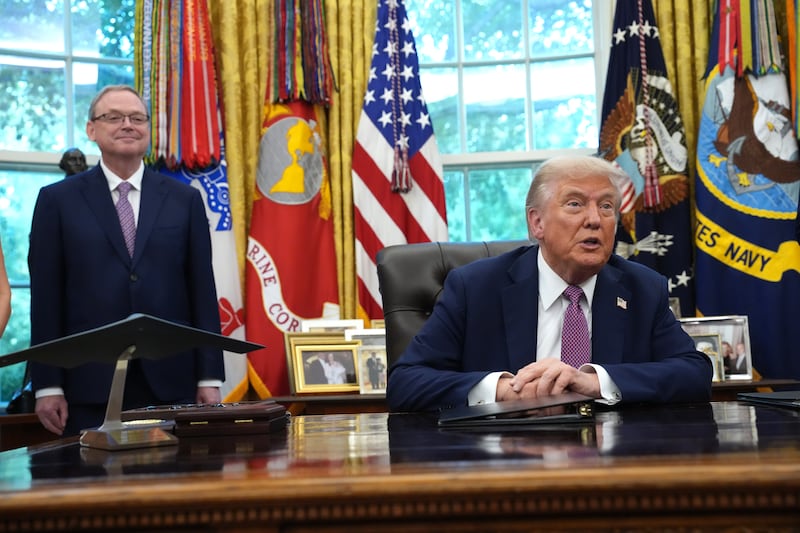 U.S. President Donald Trump speaks alongside Director of the National Economic Council Kevin Hassett during a press availability in the Oval Office