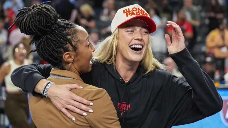  Sophie Cunningham rocks risky short skirt to caddy for Caitlin Clark