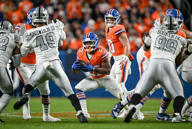 J.K. Dobbins (27) of the Denver Broncos finds a hole against the Las Vegas Raiders during the second quarter at Empower Field at Mile High Stadium on Thursday, Nov. 6, 2025. (Photo by AAron Ontiveroz/The Denver Post)