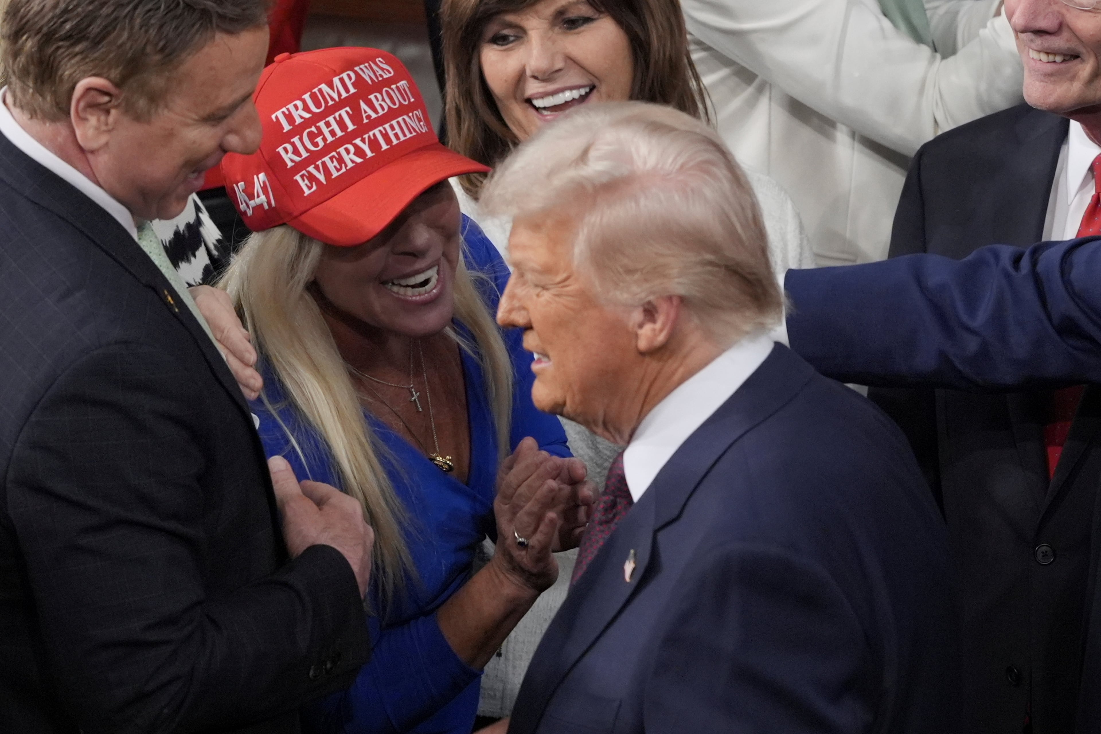 President Donald Trump walks by Rep. Marjorie Taylor Greene to address a joint session of Congress at the Capitol in Washington, D.C., on Tuesday, March 4, 2025. Trump on Saturday again branded her “Marjorie Traitor Brown.” (J. Scott Applewhite/AP)