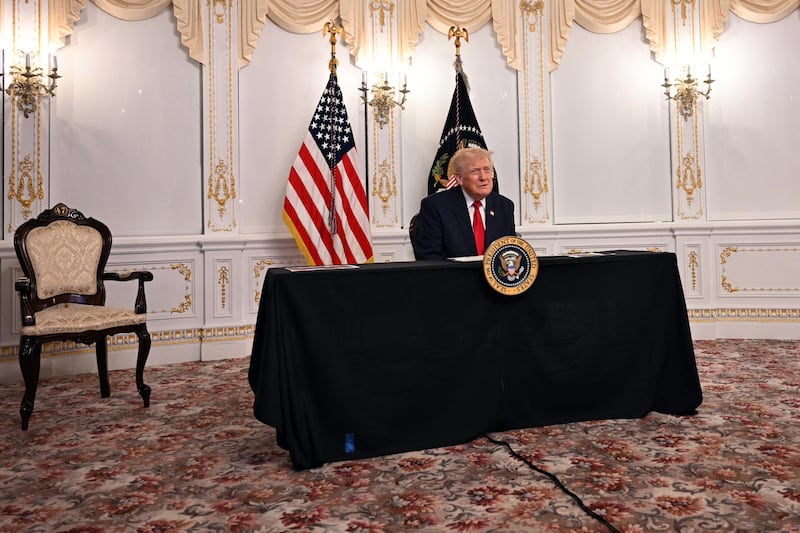 US President Donald Trump participates in a video call with military service members from his Mar-a-Lago residence in Palm Beach, Florida, on November 27, 2025, during the Thanksgiving holiday.