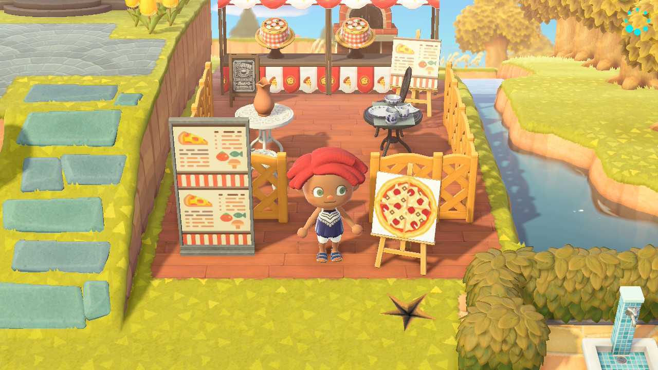 An Animal Crossing character stands in front of her pizza shop, which is marked by a custom sign and features hats decorated to look like pizzas.