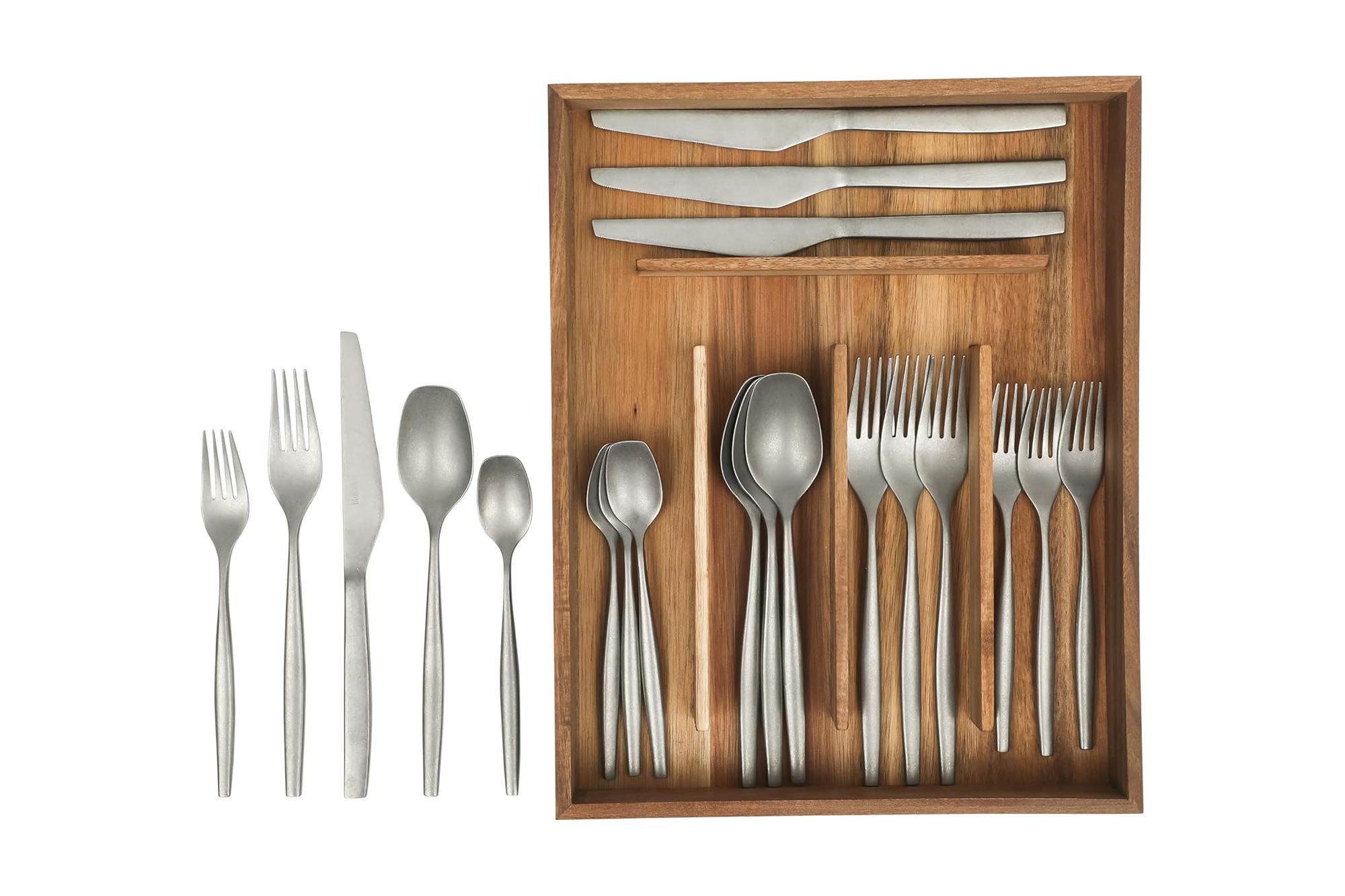 A set of silver-colored silverware, with some arranged in a wooden organizer.