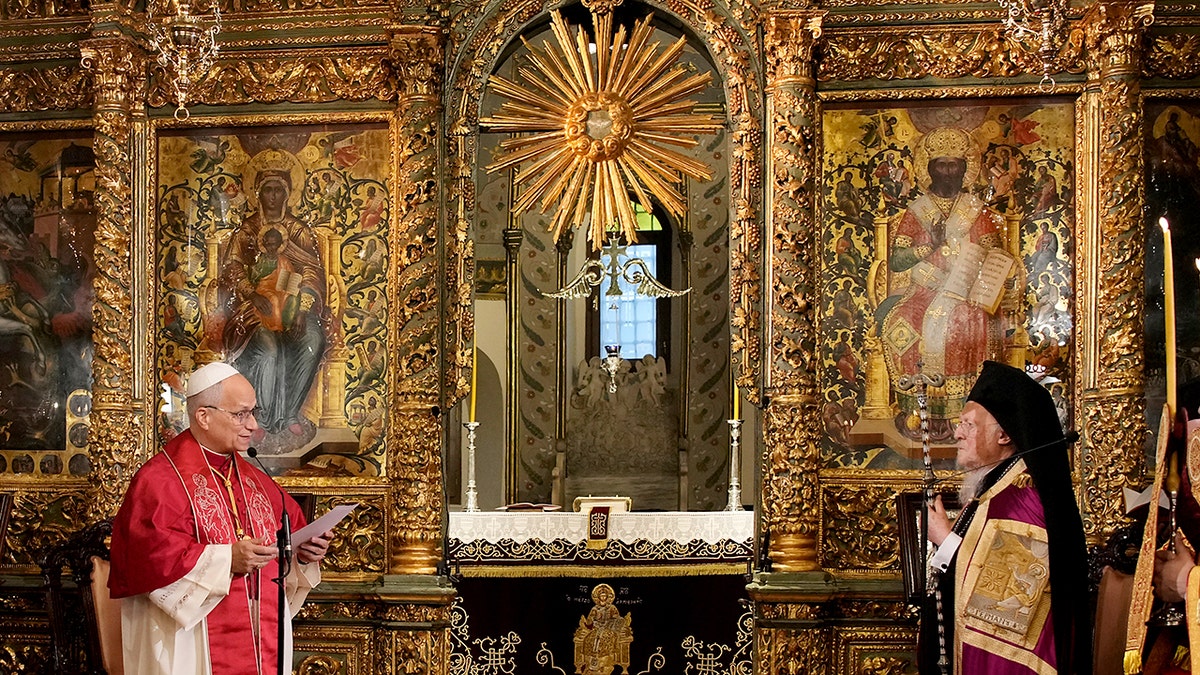 Pope Leo XIV and Ecumenical Patriarch Bartholomew I stand before an ornate gold iconostasis during a service in Istanbul.