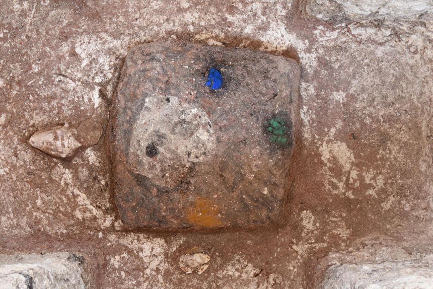 Colored pigments, thought to represent north, south, east and west, were found in a cruciform cache at the center of the monument.