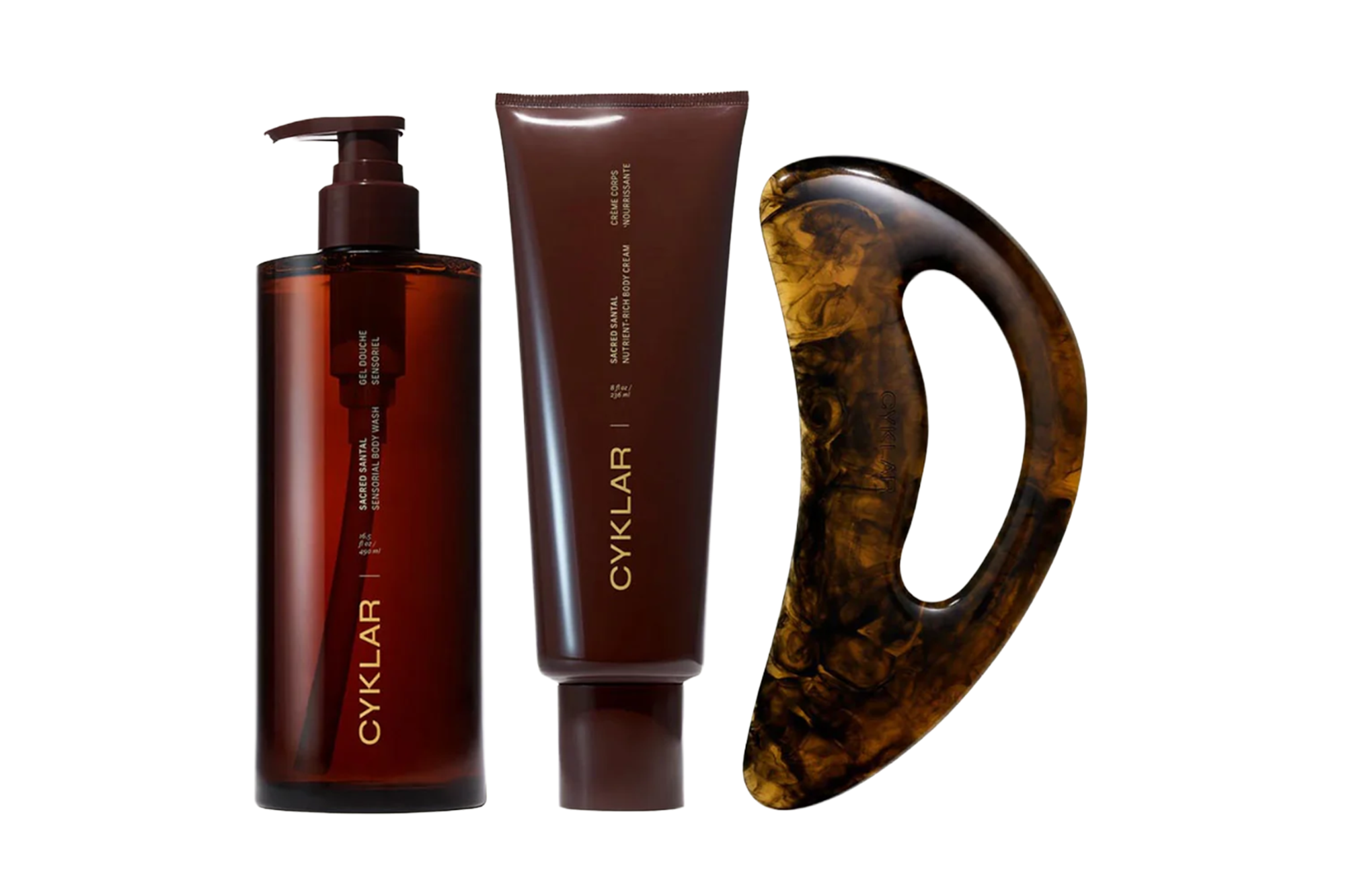 CYKLAR Sacred Santal Sensorial Body Wash, Nutri-Rich Body Cream, and a marbeled body tool.