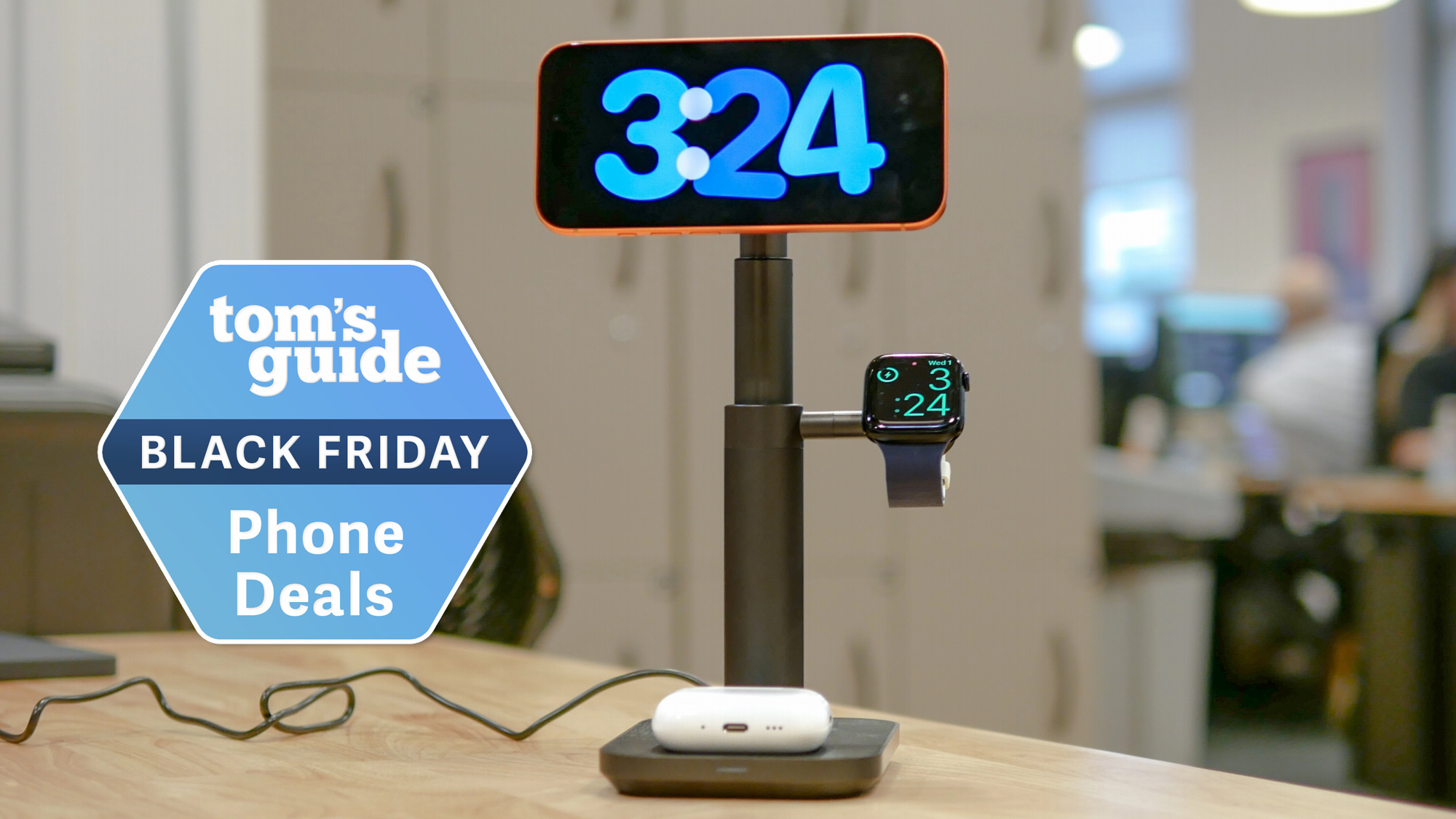 Mophie 3-in-1 Extendable MagSafe Stand charging iPhone, Apple Watch, and AirPods with Black Friday badge nearby.