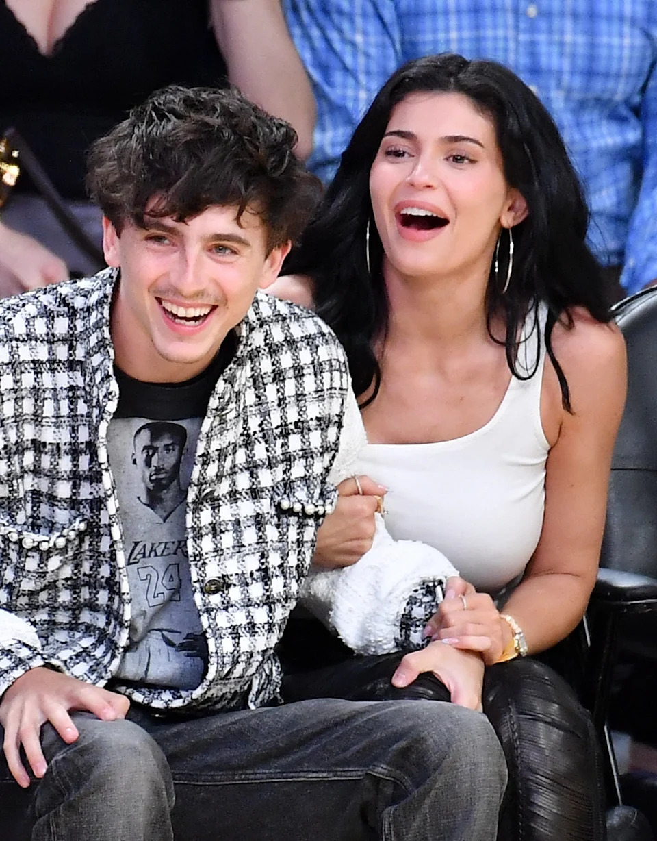 Timothée and Kylie sitting courtside at a basketball game