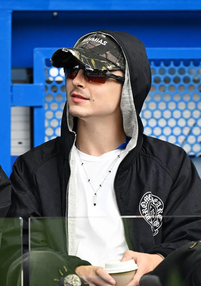 Timothée in casual streetwear at a stadium