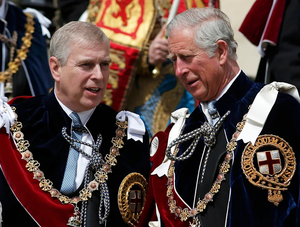King Charles talking to Prince Andrew while wearing Order of the Garter robes