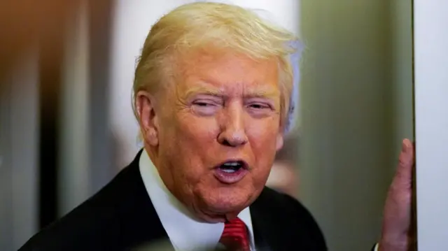 Donald trump speaking to reporters on Air Force One on Sunday 2 November