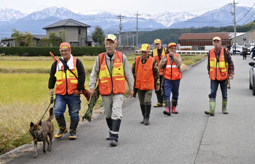 A group of hunters patrol an area near the scene of a bear attack in Toyama, Japan, on November 16, 2023.
