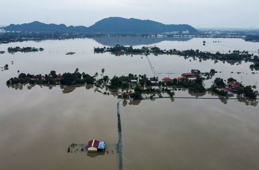 Homes were surrounded by flood waters in Kangar, part of Malaysia's Perlis state, on November 28, as severe flooding affected thousands of people in the region following days of heavy rain.