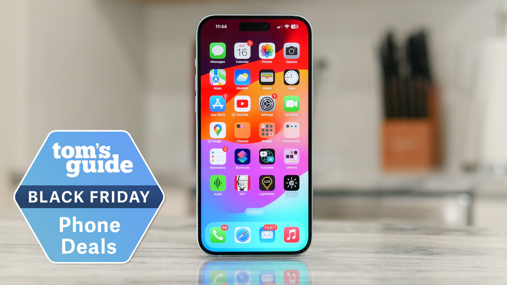 iPhone 15 Plus standing upright on table with Black Friday badge nearby.