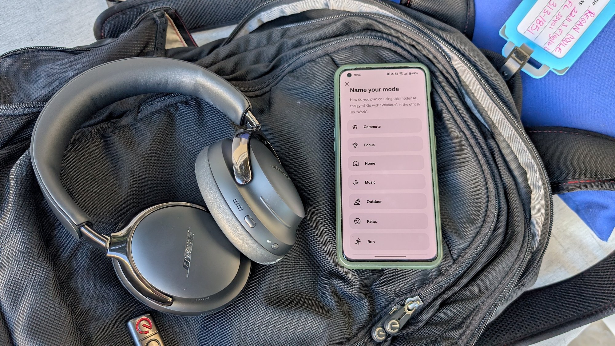 The Bose QC Ultra (Gen 2) headphones next to the Bose app, which is open to the Modes page.