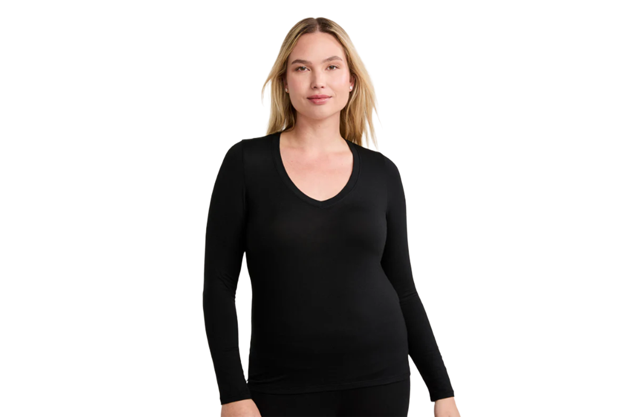 A woman wearing a black long-sleeved V-neck shirt.