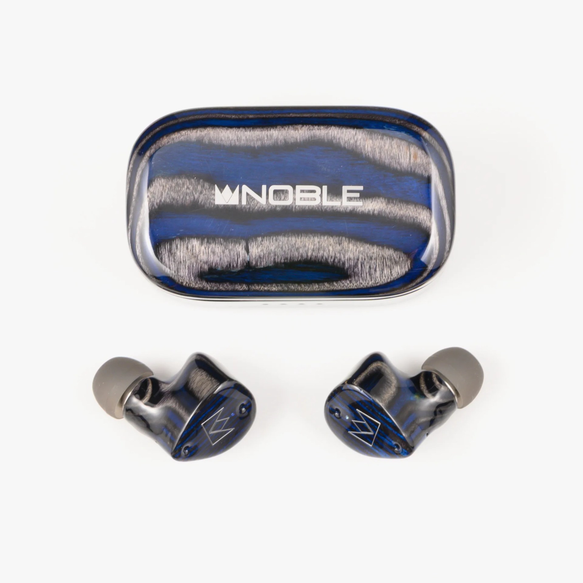 Blue and black marbled wireless earbuds with gray ear tips and matching charging case with 