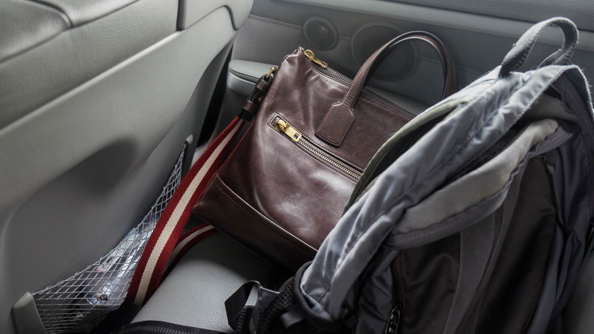 work briefcases scattered in car backseat