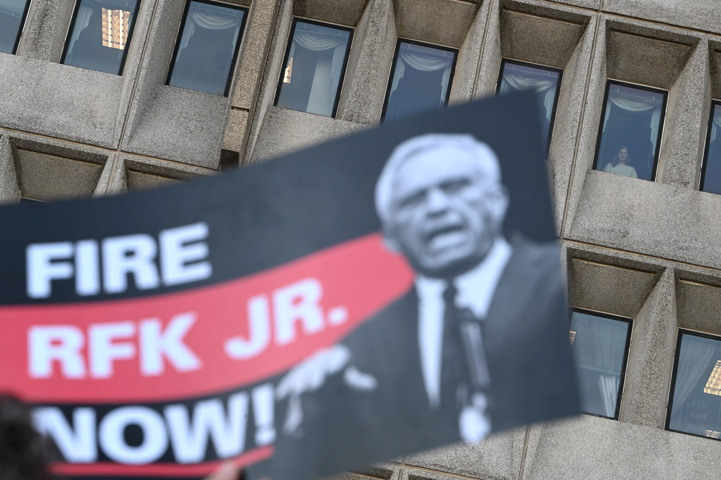 poster calling for the removal of RFK as the head of the HHS