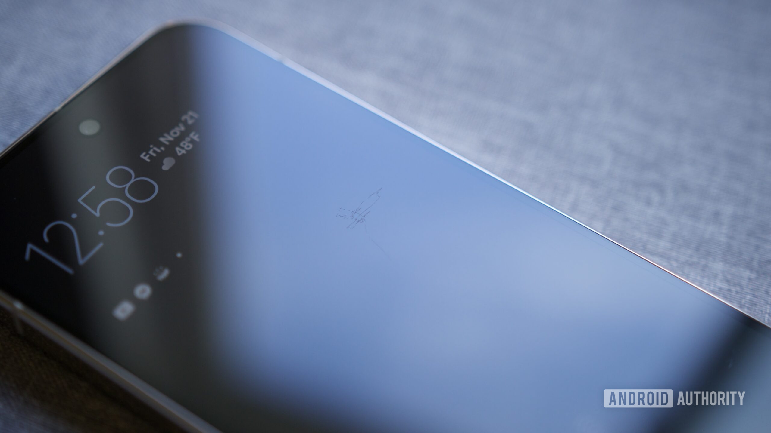 A close-up photo of a Pixel 10 Pro with scratches on its screen.