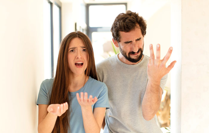 Young woman and man arguing indoors, highlighting conflict about health nut roomie and strict diet triggering ED. Young woman and man arguing indoors, highlighting conflict about health nut roomie and strict diet triggering ED.