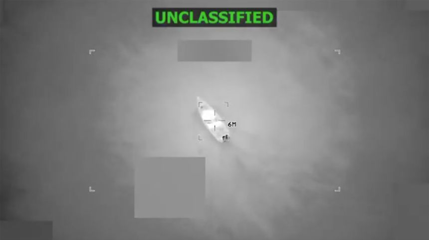 This screengrab taken from a video posted by Defense Secretary Pete Hegseth on October 24, shows a boat in the Caribbean Sea shortly before it is hit by a strike.