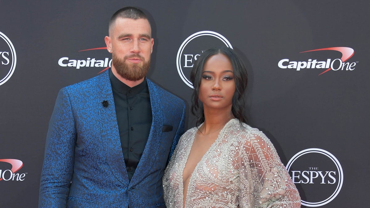 Travis Kelce and Kayla Nicole on a red carpet