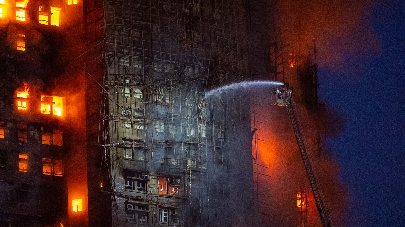  13 people killed in fire engulfing Hong Kong high-rise residential buildings, fire services say : NPR