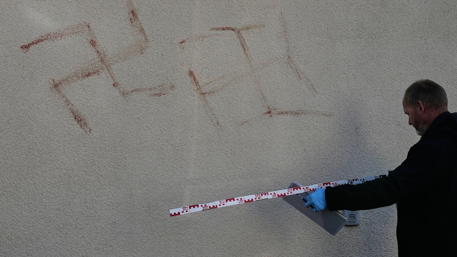  Dozens of swastikas painted in human blood daubed on property across German city