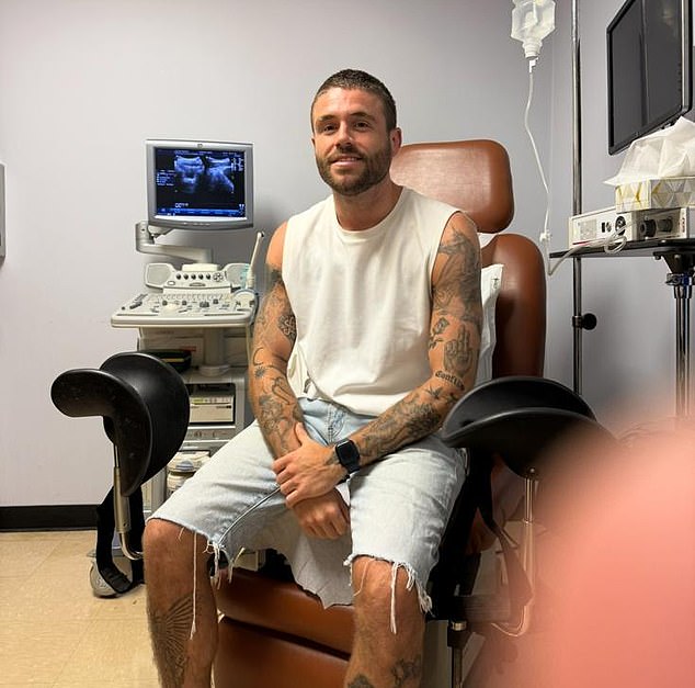 Pictured: I wear a sheepish look as I wait to hear what stage the cancer has reached