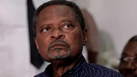 AFP via Getty Images Anicet Ekane in July.