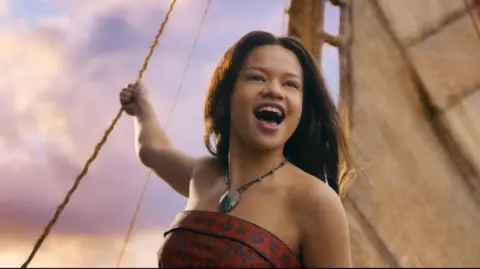 Walt Disney Catherine Laga'aia on a sailing boat as Moana