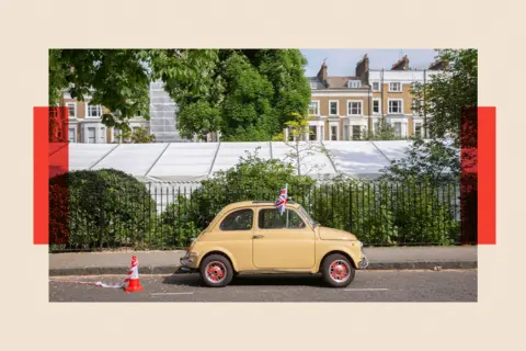 In Pictures via Getty Images Images A beige Fiat 500 classic car in a parking bay 