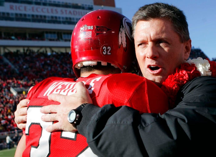 (Trent Nelson | The Salt Lake Tribune) Kyle Whittingham embraces defensive back Eric Weddle on senior day in 2006.