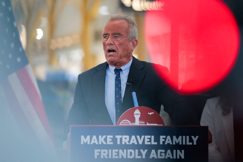 ARLINGTON, VA - DECEMBER 08: U.S. Human Services Secretary Robert F. Kennedy Jr. speaks at a conference discussing the launch of the "Make Travel Family Friendly Again" campaign at Ronald Reagan Washington National Airport on December 08, 2025 in Arlington, Virginia. The campaign's focus is to incentivize family-friendly resources at airports. (Photo by Heather Diehl/Getty Images)