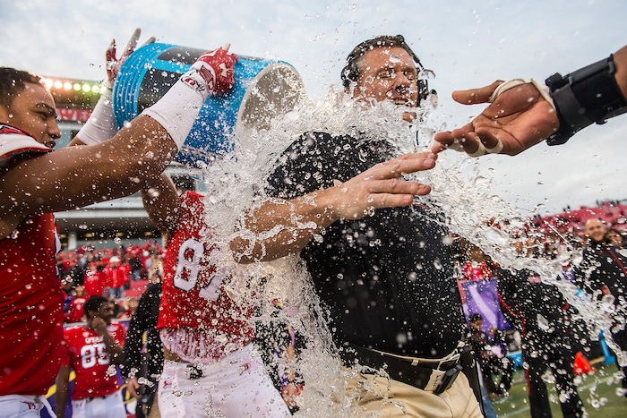 (Chris Detrick | The Salt Lake Tribune) Utah players dump a cooler of water on Kyle Whittingham after winning the Las Vegas Bowl, Dec. 20, 2014.