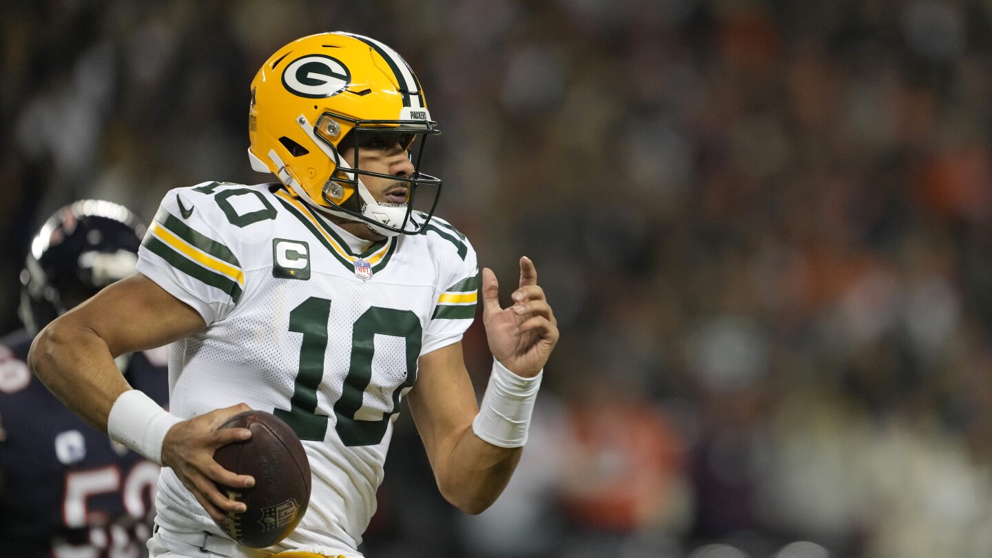  Jordan Love leaves game for training room after taking an illegal hit