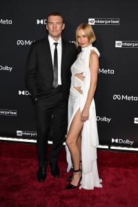 Sam Worthington and Lara Worthington at the “Avatar: Fire and Ash” World Premiere held at the Dolby Theatre on December 01, 2025 in Los Angeles, California.