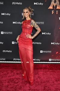 Snitchery and Eleanor Barnes at the “Avatar: Fire and Ash” World Premiere held at the Dolby Theatre on December 01, 2025 in Los Angeles, California.