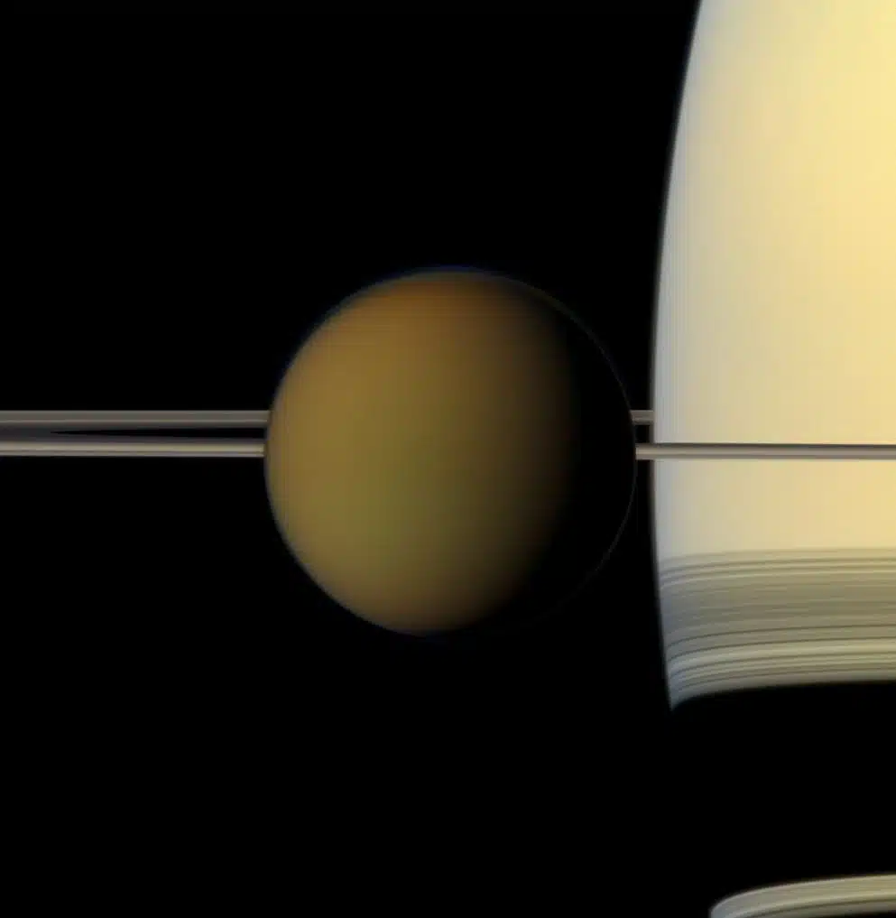 Titan Drifts Past Saturn In This Striking Image From Nasa’s Cassini Mission.