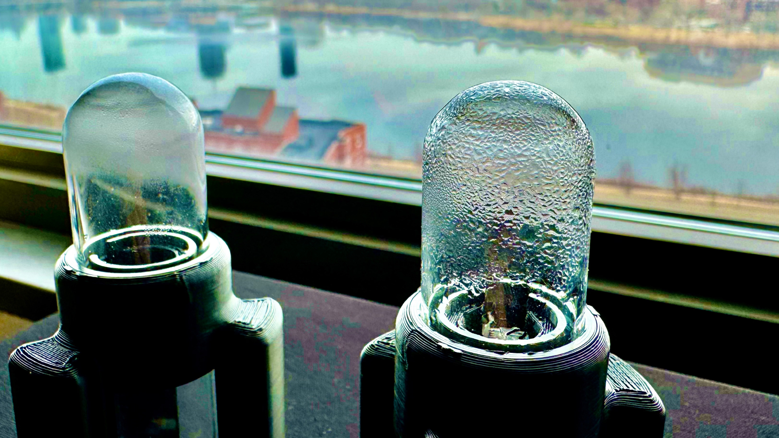Two prototypes of the ultrasonic system used to “shake” water out of an atmospheric water harvester.
