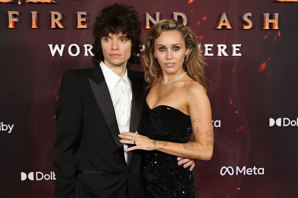 HOLLYWOOD, CALIFORNIA - DECEMBER 01: (L-R) Maxx Morando and Miley Cyrus attend the Global Premiere of 20th Century Studios' "Avatar: Fire And Ash" at Dolby Theatre on December 01, 2025 in Hollywood, California. (Photo by Kevin Winter/WireImage)