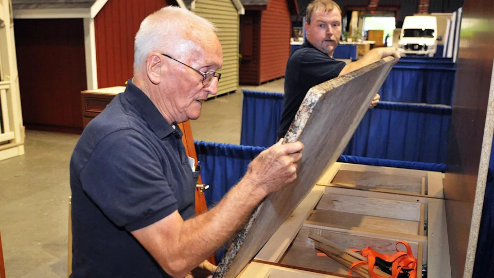 father and son install quartz countertop
