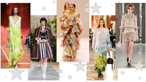 BBC Five pictures of models walking down the catwalk. The first is in a fringed green dress with low v-neck; the second wears a striped pleated midi skirt, shirt and tie, tank top and blazer with brown leather coat draped over her shoulders; the third wears an off-shoulder, ruffled multicolour dress; the fourth wears a head-to-toe tasseled outfit with ombre blue and green effect; the fifth wears a ruffled mulitcolour mini skirt with ruffled three-quarter length sleeve top   