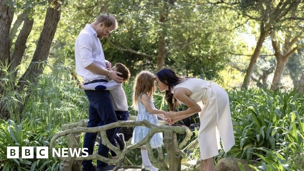  Harry and Meghan embrace children Archie and Lilibet in Christmas photo